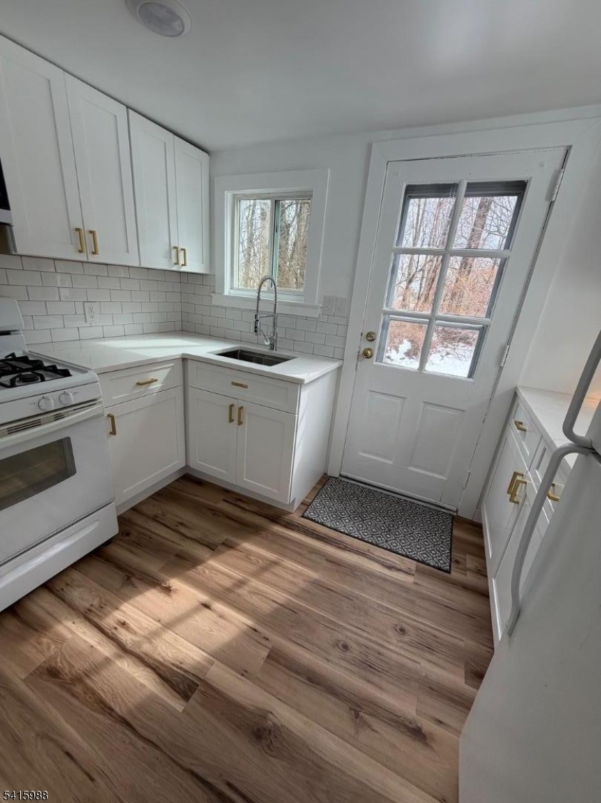 638 Spring Valley Road, Unit 1 Morristown, NJ 07960 - Photo 5 of 11 a kitchen with a cabinets appliances and a window