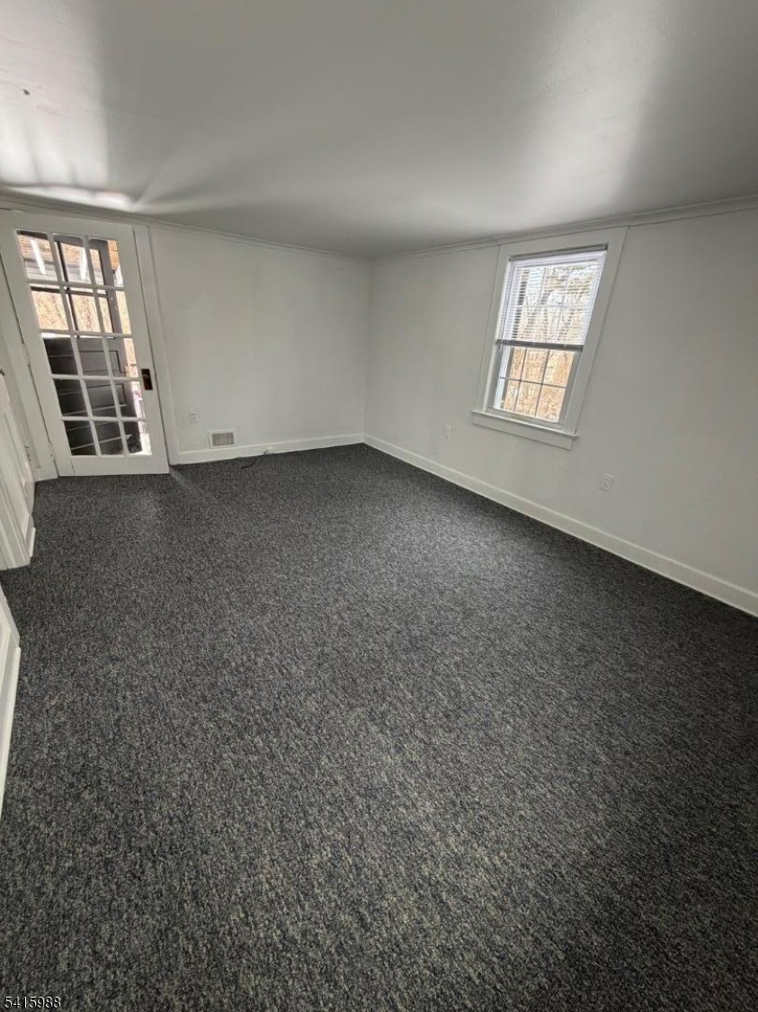 638 Spring Valley Road, Unit 1 Morristown, NJ 07960 - Photo 7 of 11 an empty room with windows
