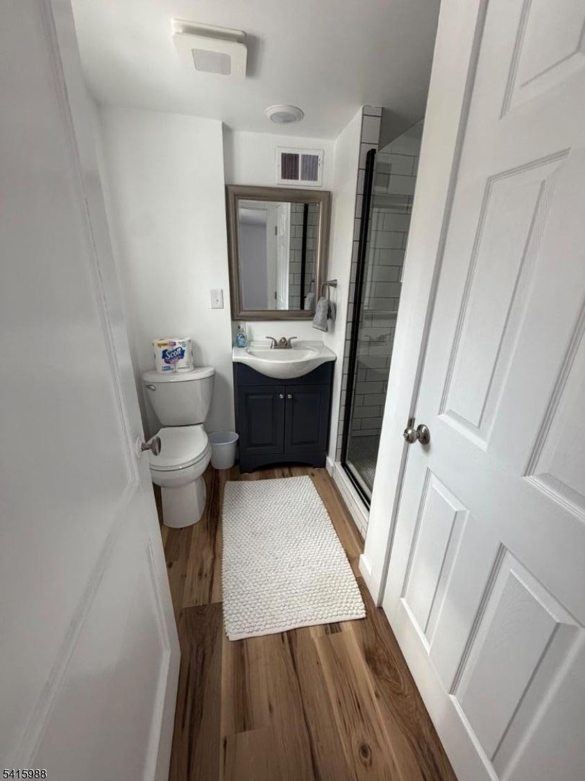 638 Spring Valley Road, Unit 1 Morristown, NJ 07960 - Photo 8 of 11 a bathroom with a sink a toilet a mirror and tub