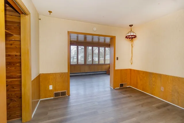 a view of room with wooden floor