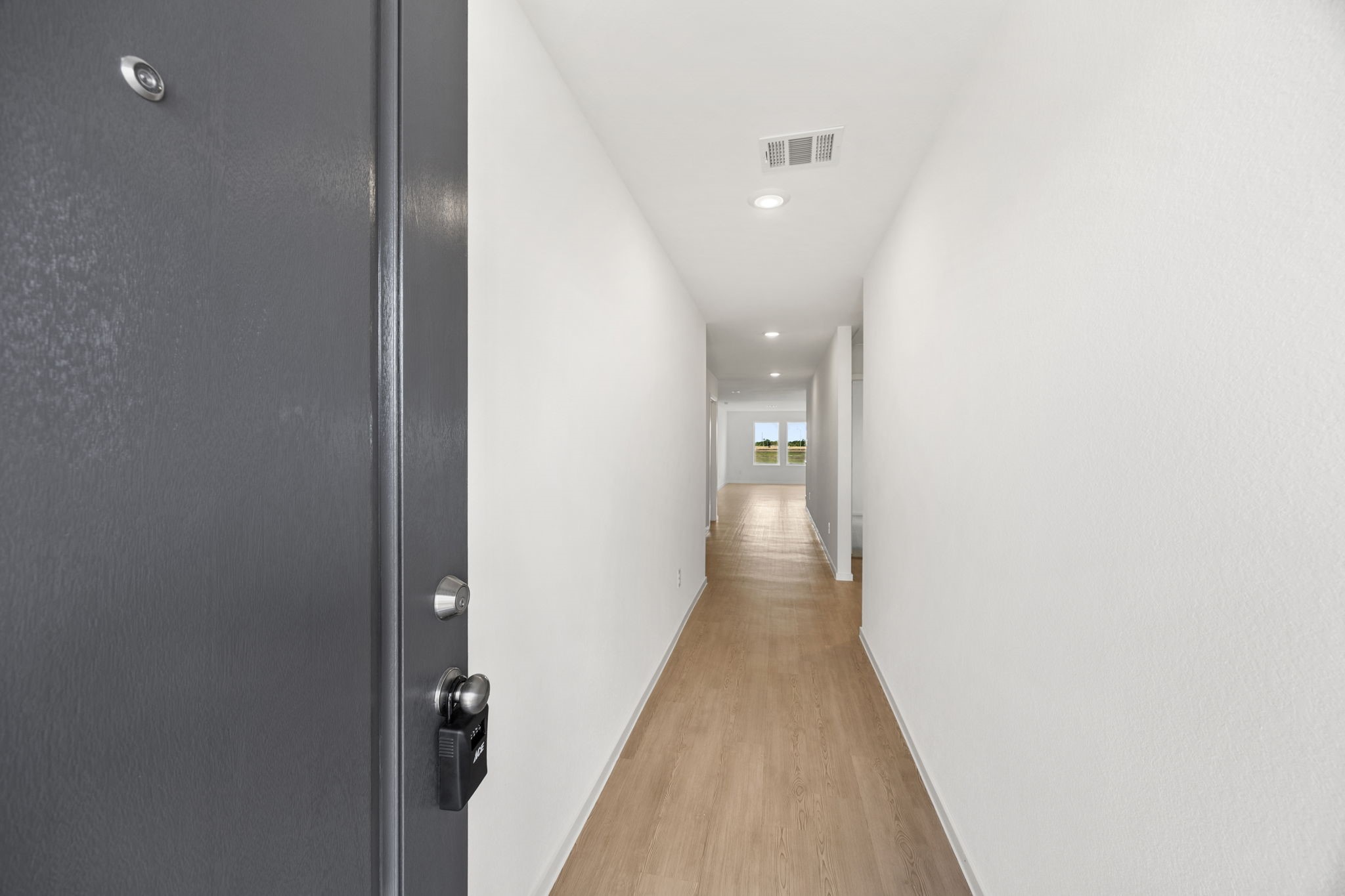 3032 Colusa Rdg Drive Katy, TX 77493 - Photo 3 of 21 a view of a hallway with wooden floor