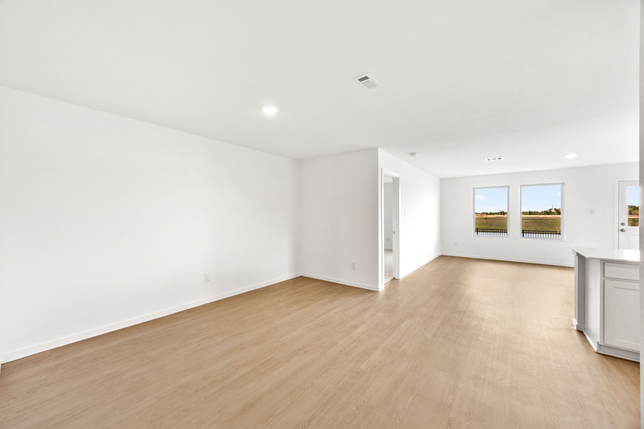 3032 Colusa Rdg Drive Katy, TX 77493 - Photo 4 of 21 a view of an empty room with a kitchen