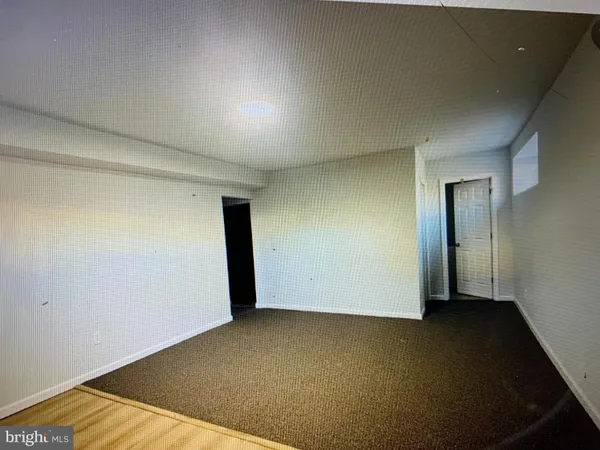 an empty room with a wooden door