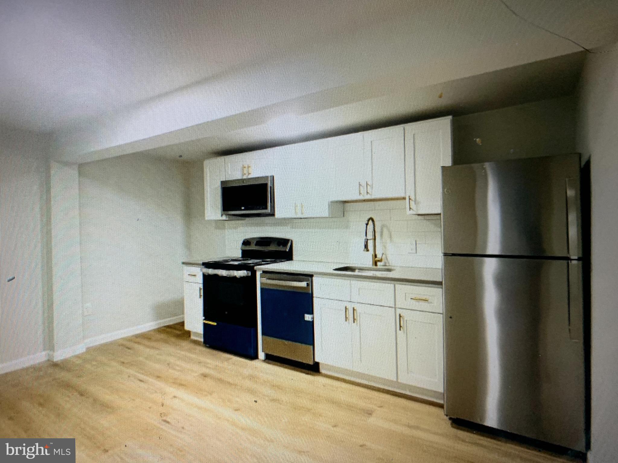 401 Blue Bell Road, Unit C Williamstown, NJ 08094 - Photo 5 of 10 Modern kitchen with sleek appliances.