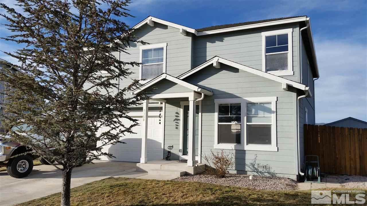 8960 Griffon Court Reno, NV 89506 - Photo 1 of 1 a front view of a house with garden