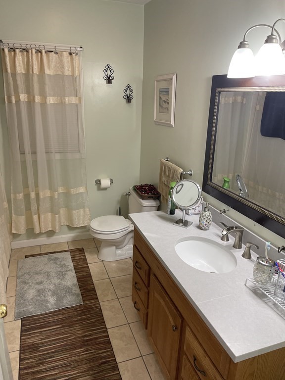 89 West Boylston Street, Unit 3 Worcester, MA 01606 - Photo 6 of 9 a bathroom with a sink and a mirror