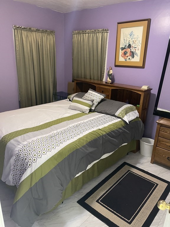 89 West Boylston Street, Unit 3 Worcester, MA 01606 - Photo 9 of 9 a bedroom with a bed and a window