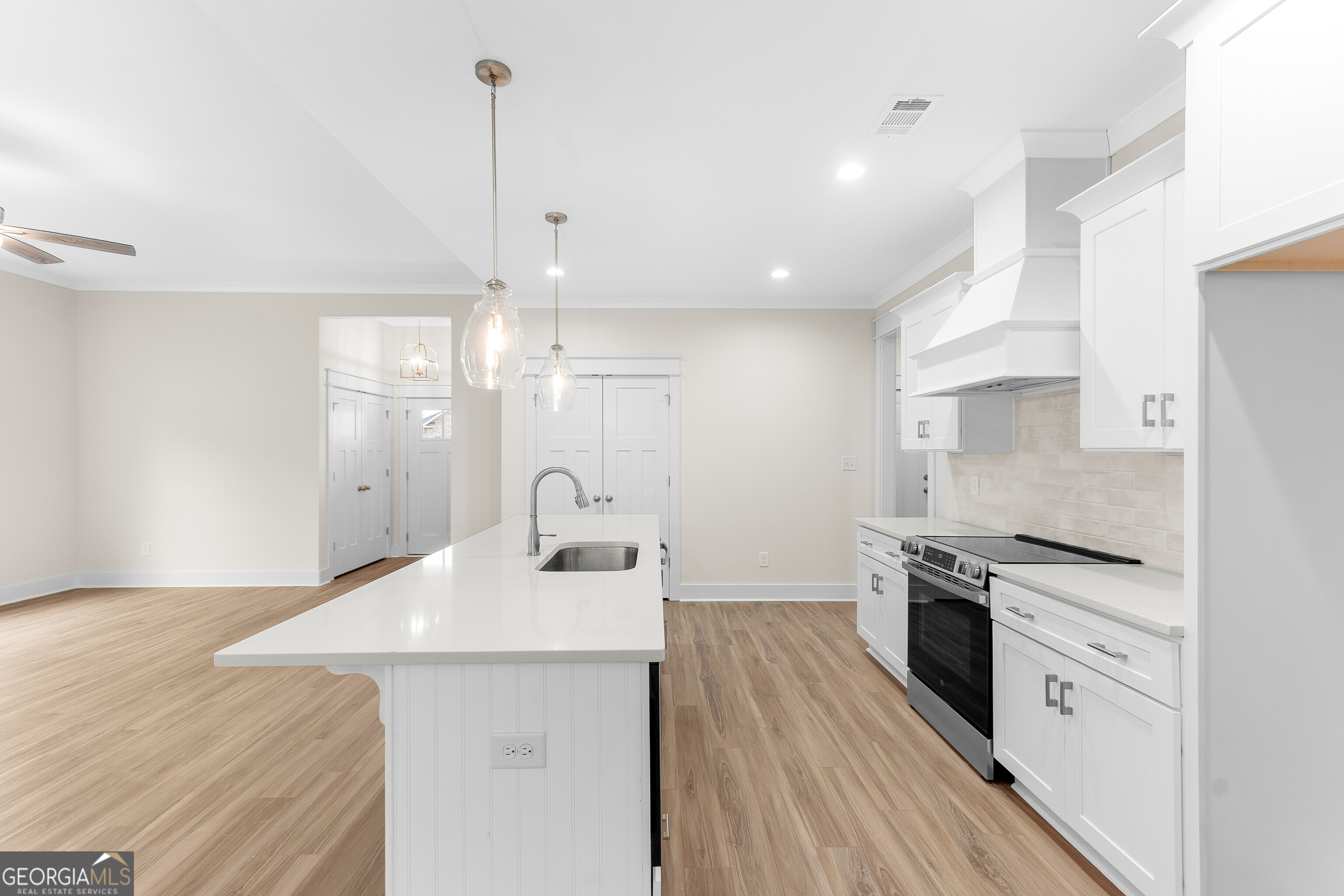 608 Bristleleaf Path Kathleen, GA 31047 - Photo 16 of 48 a kitchen with stainless steel appliances a sink stove and refrigerator