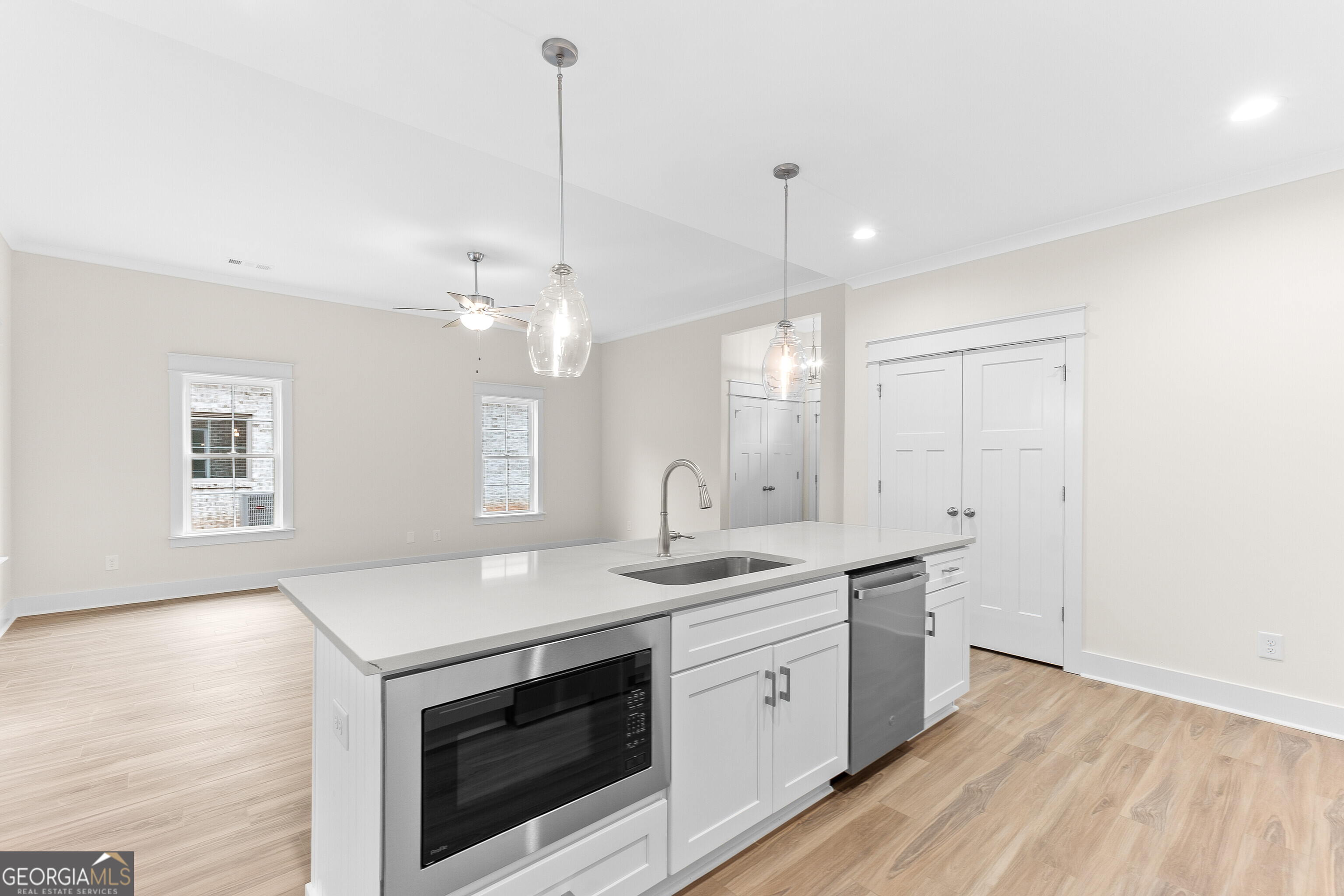 608 Bristleleaf Path Kathleen, GA 31047 - Photo 20 of 48 a kitchen with a sink stove and cabinets