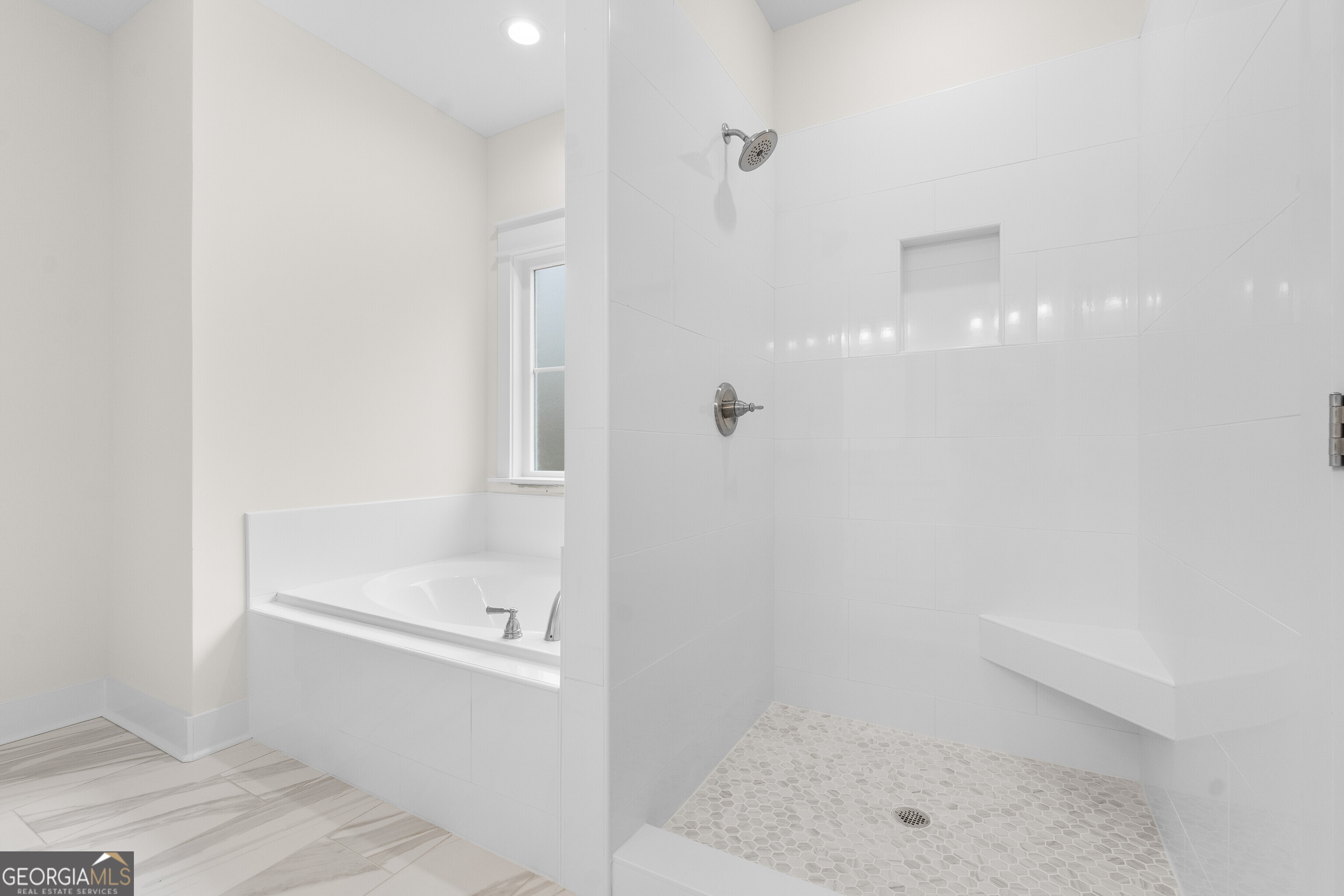 608 Bristleleaf Path Kathleen, GA 31047 - Photo 29 of 48 a bathroom with a shower and bathtub