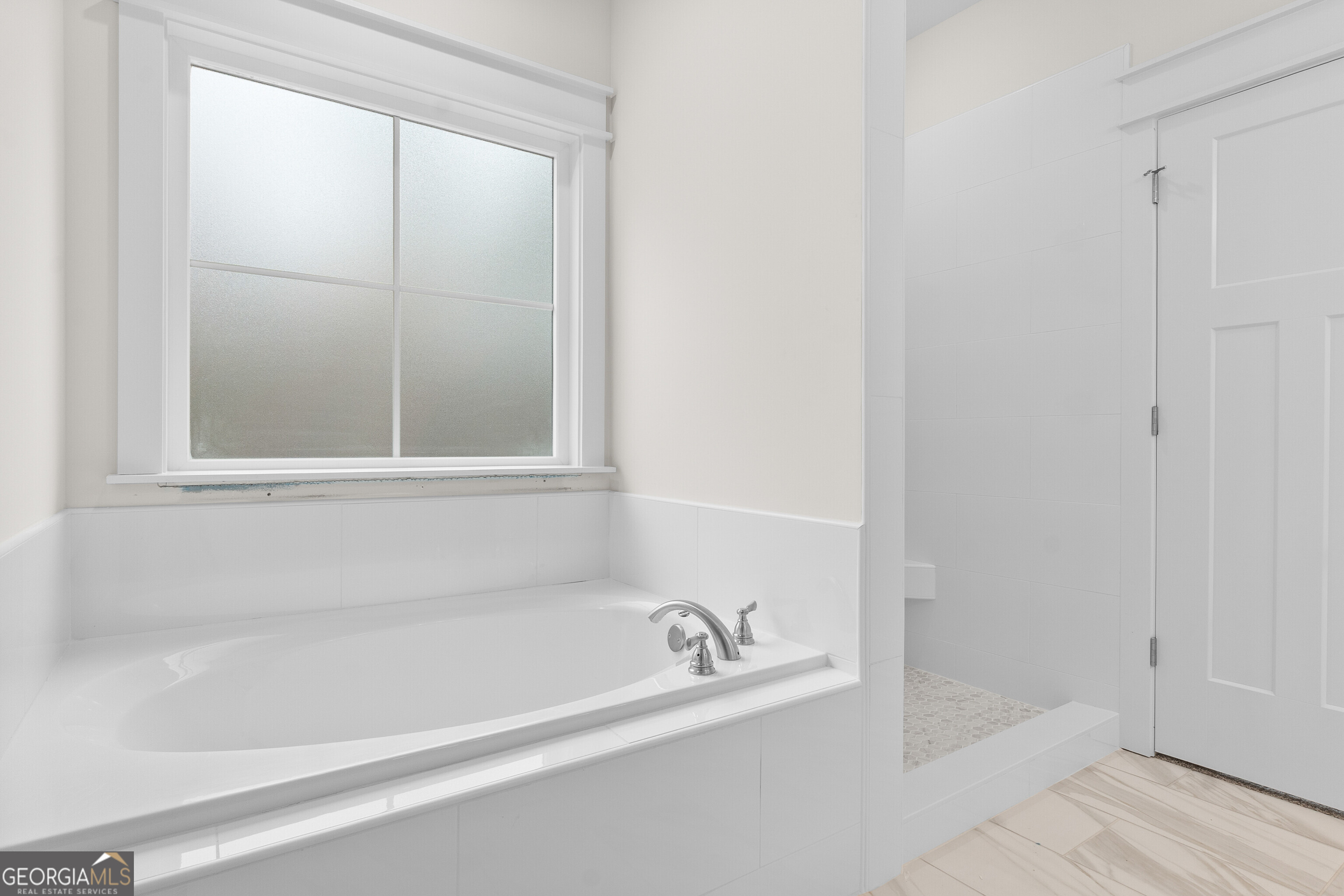 608 Bristleleaf Path Kathleen, GA 31047 - Photo 32 of 48 a white bath tub sitting next to a shower