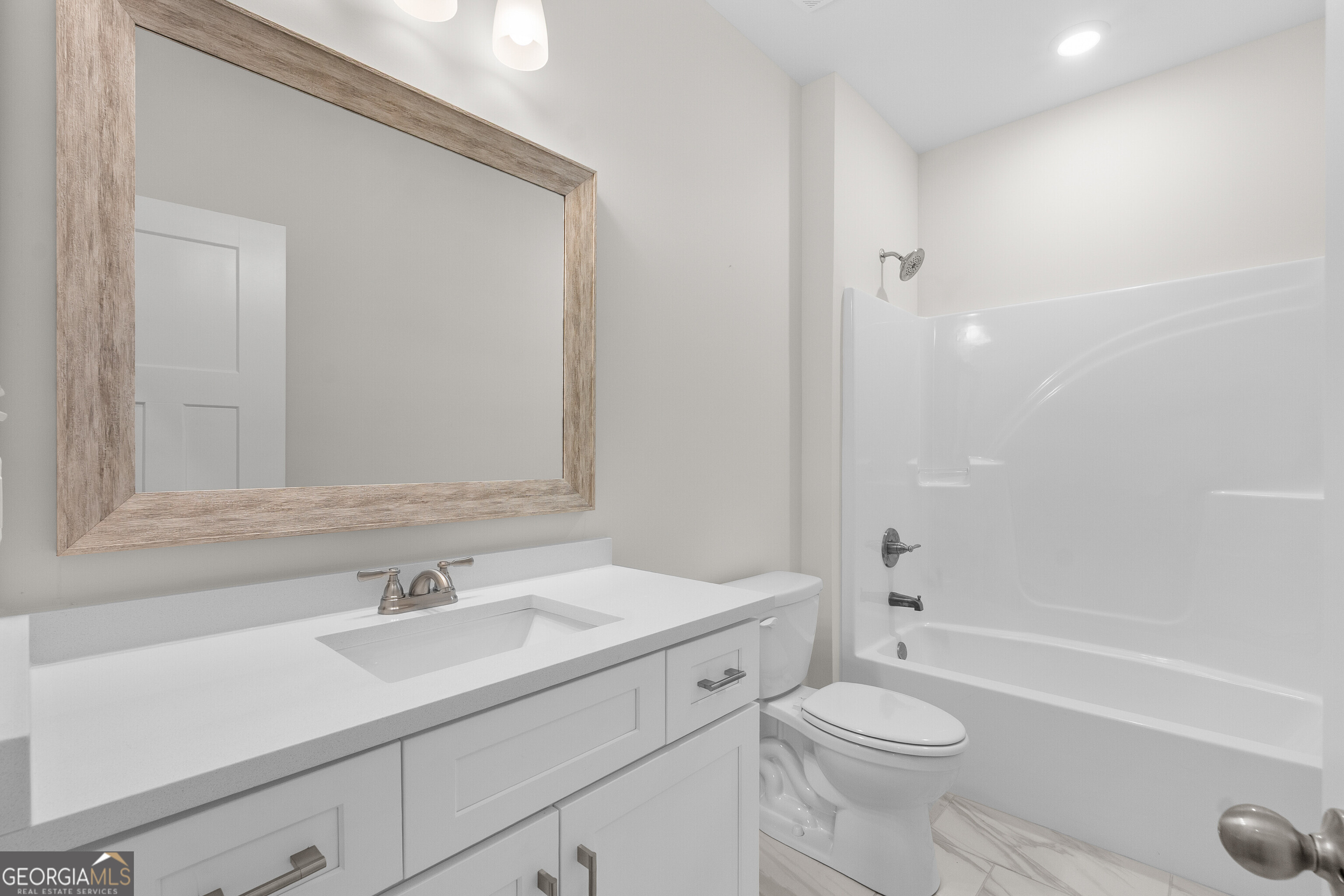 608 Bristleleaf Path Kathleen, GA 31047 - Photo 36 of 48 a bathroom with a sink a toilet and shower