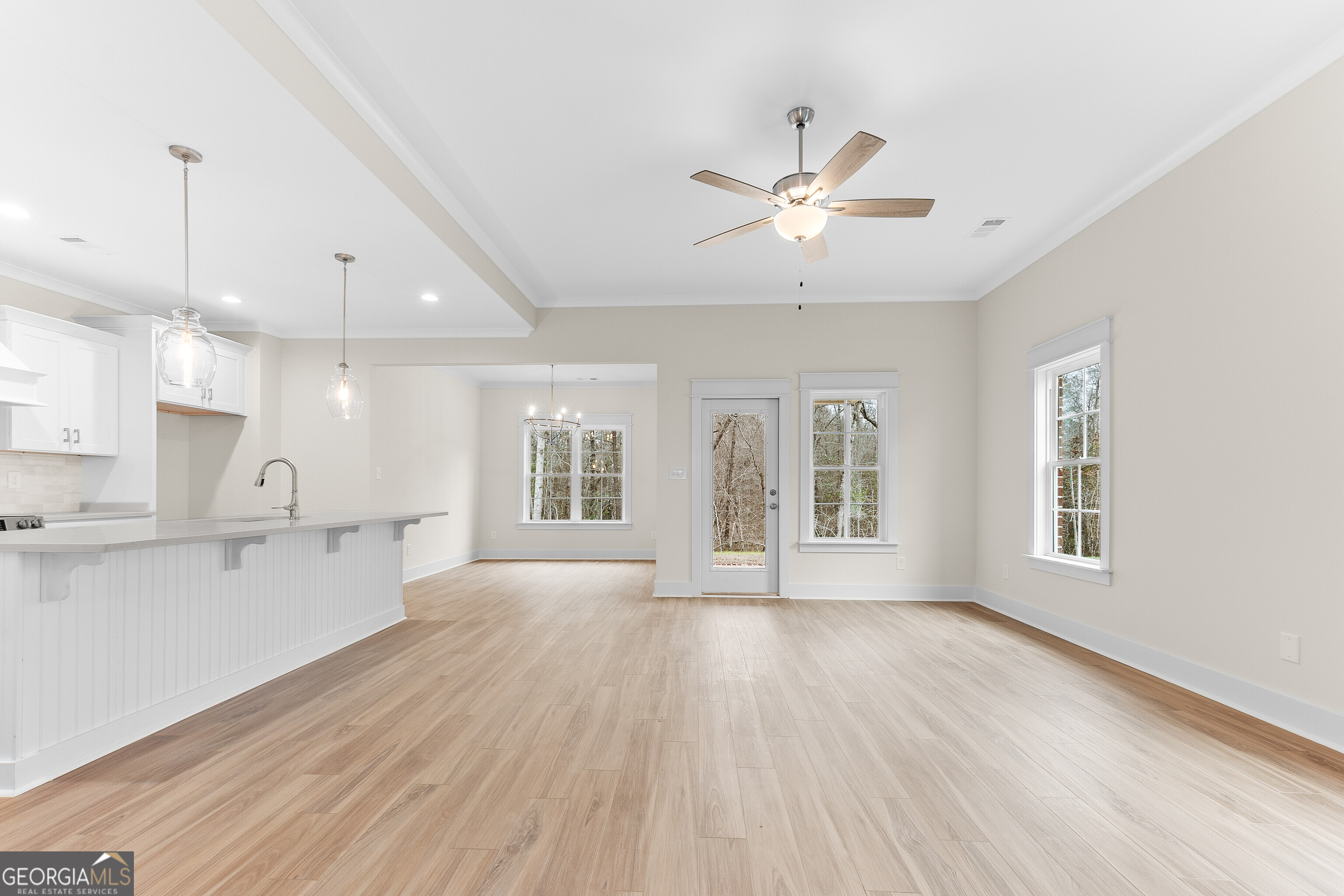 608 Bristleleaf Path Kathleen, GA 31047 - Photo 5 of 48 a view of an empty room with a kitchen and a window
