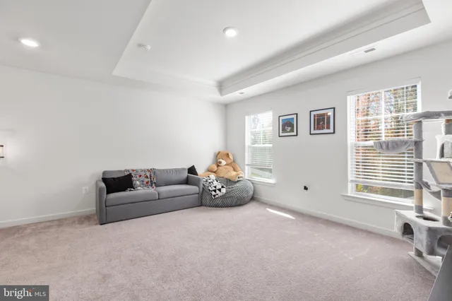 a view of walk in closet with clothes