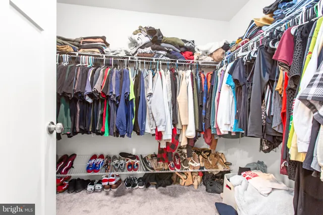 a view of a patio with table and chairs and wooden floor