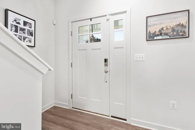 a view of a workspace with furniture and a potted plant