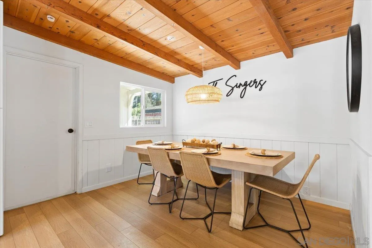 13509 East Lakeview Road Lakeside, CA 92040 - Photo 11 of 43 a view of a dining room with furniture and wooden floor