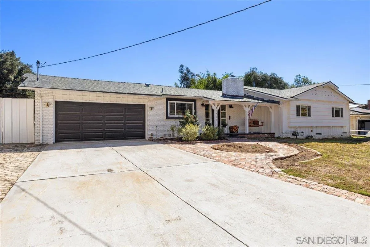 13509 East Lakeview Road Lakeside, CA 92040 - Photo 2 of 43 a front view of a house with a yard and garage