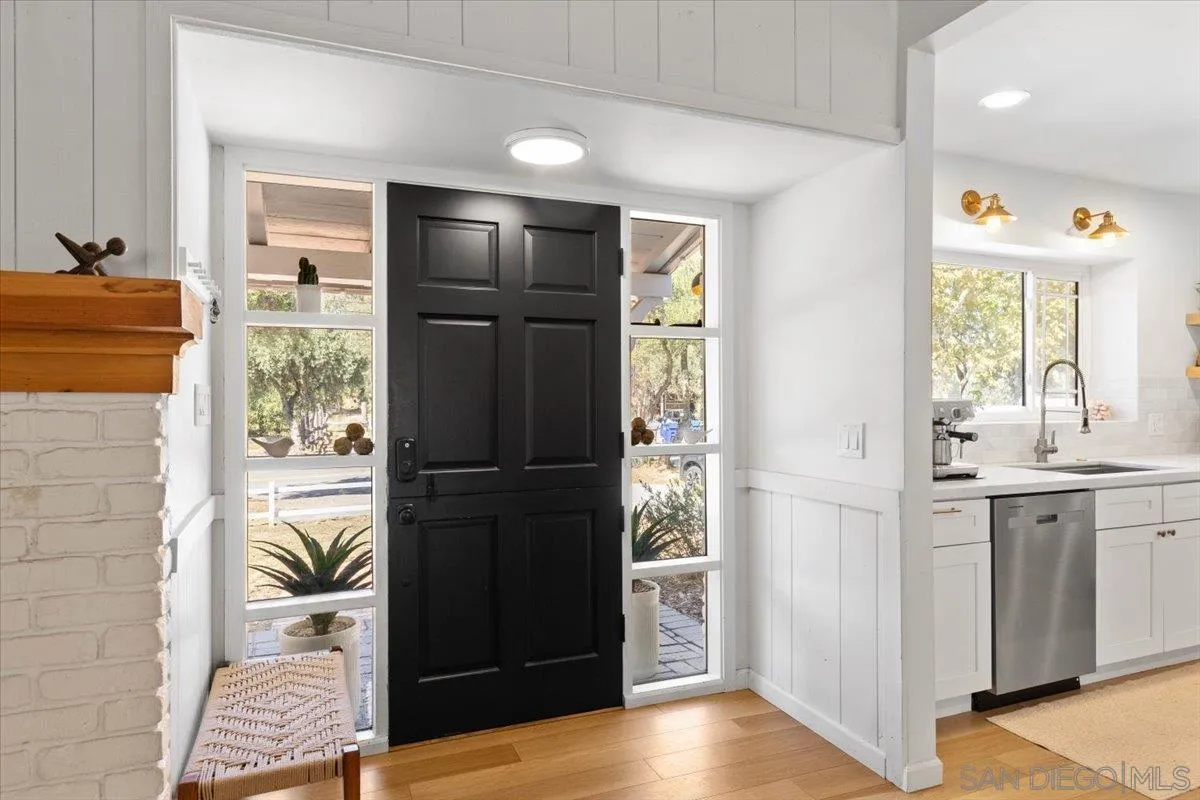 13509 East Lakeview Road Lakeside, CA 92040 - Photo 23 of 43 a kitchen with a refrigerator and a stove top oven