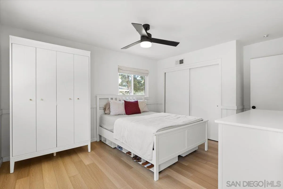 13509 East Lakeview Road Lakeside, CA 92040 - Photo 26 of 43 a bedroom with a bed and a table