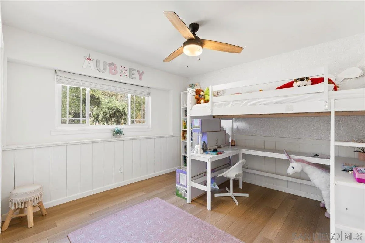 13509 East Lakeview Road Lakeside, CA 92040 - Photo 28 of 43 a bedroom with a bed and a chandelier