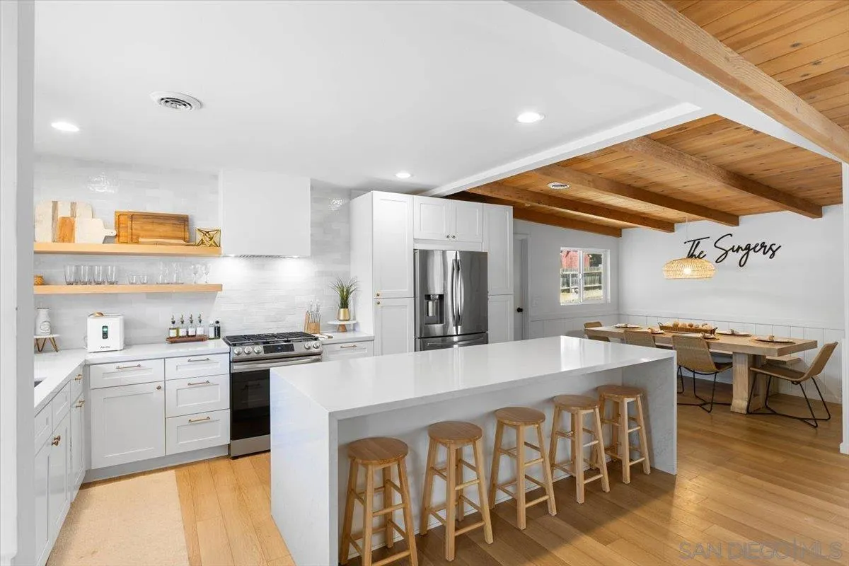 13509 East Lakeview Road Lakeside, CA 92040 - Photo 4 of 43 a large kitchen with a table and chairs in it