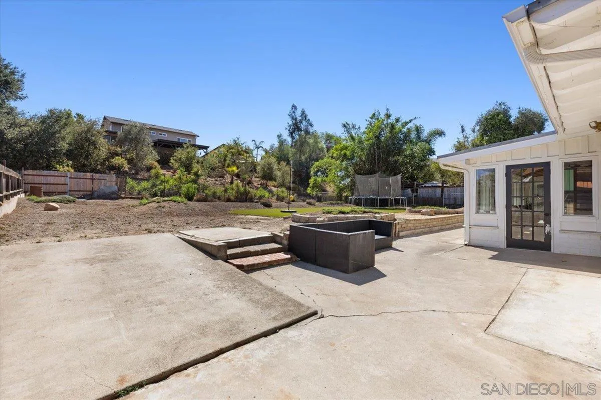 13509 East Lakeview Road Lakeside, CA 92040 - Photo 43 of 43 a swimming pool with outdoor seating and plants
