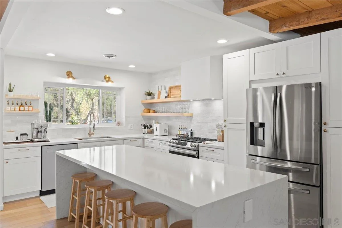 13509 East Lakeview Road Lakeside, CA 92040 - Photo 5 of 43 a kitchen with kitchen island a sink stove and refrigerator