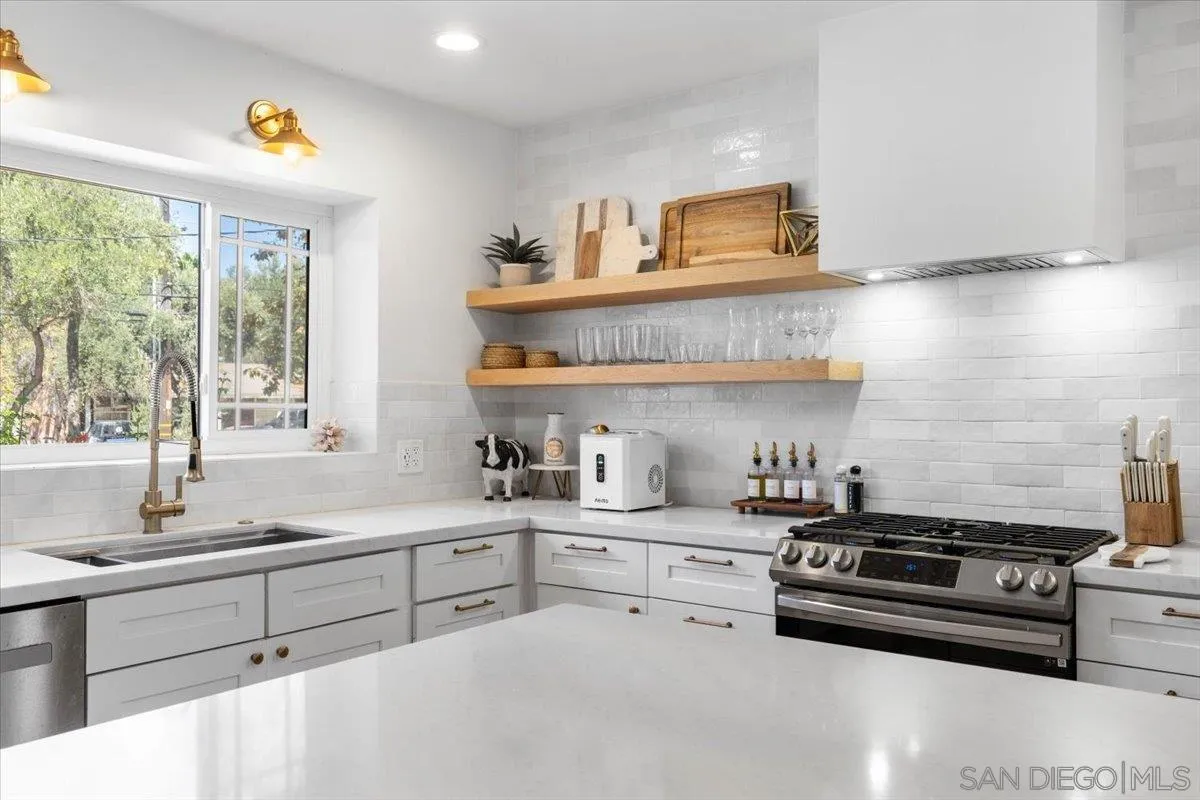 13509 East Lakeview Road Lakeside, CA 92040 - Photo 6 of 43 a kitchen with stainless steel appliances a sink a stove and a window