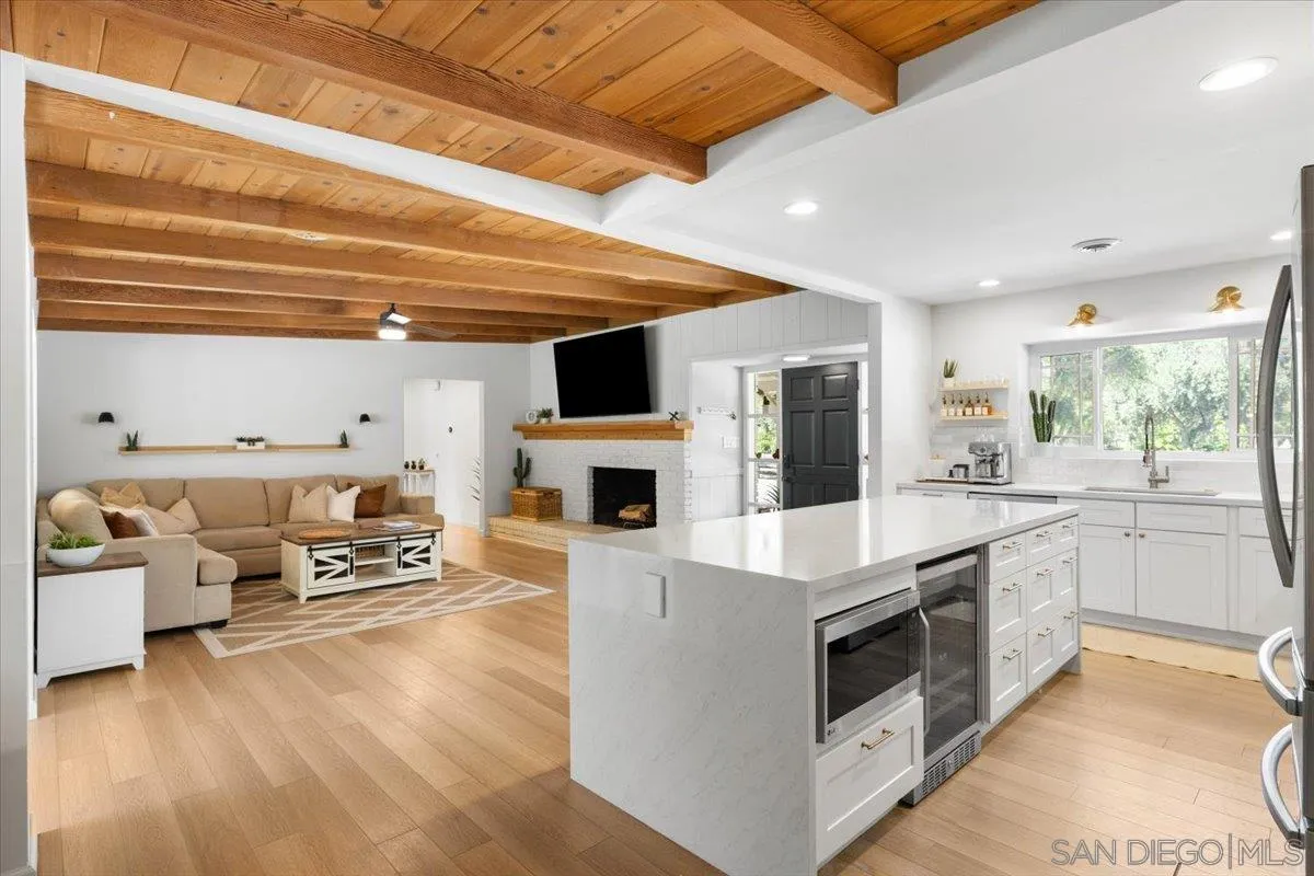 13509 East Lakeview Road Lakeside, CA 92040 - Photo 10 of 43 a kitchen with stainless steel appliances kitchen island granite countertop a stove and a refrigerator