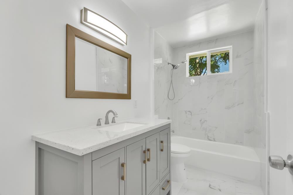 8843 Pershing Avenue Orangevale, CA 95662 - Photo 11 of 29 a bathroom with a sink and a bathtub