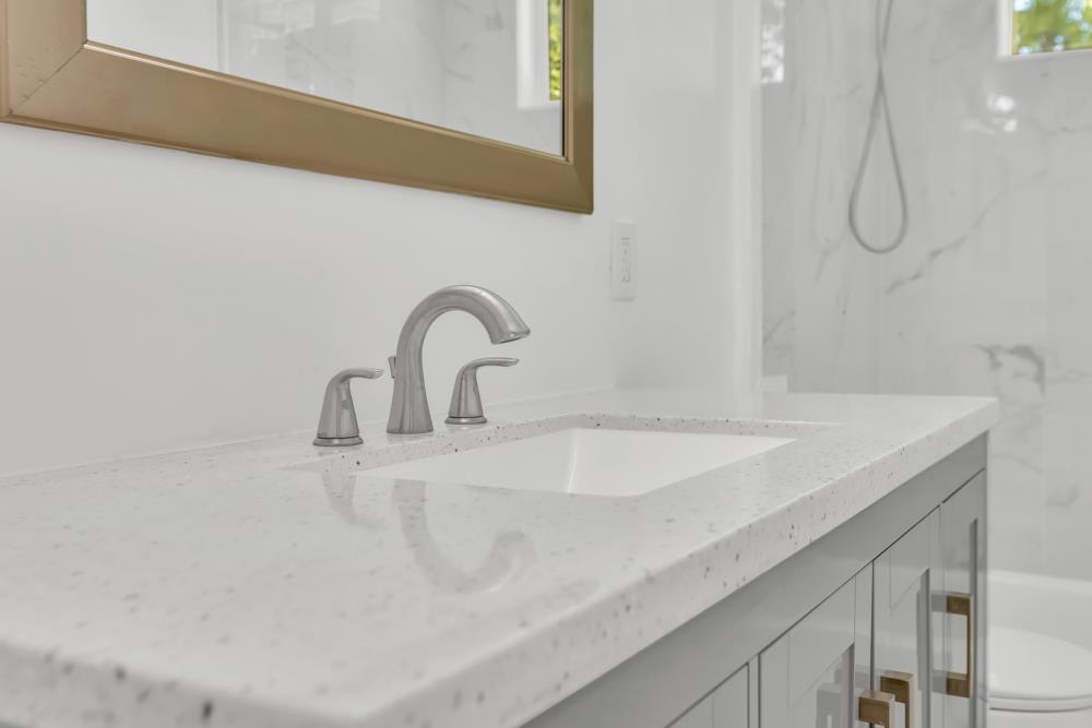 8843 Pershing Avenue Orangevale, CA 95662 - Photo 12 of 29 a close view of a sink a faucet and a shower in a bathroom