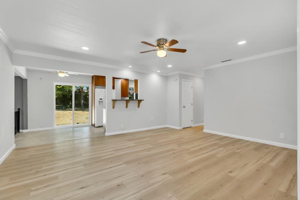 8843 Pershing Avenue Orangevale, CA 95662 - Photo 2 of 29 a view of an empty room with wooden floor and a window