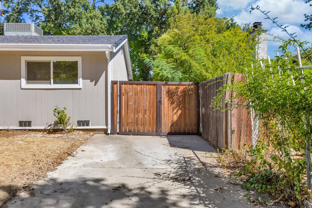 8843 Pershing Avenue Orangevale, CA 95662 - Photo 25 of 29 a view of backyard with potted plants and wooden fence