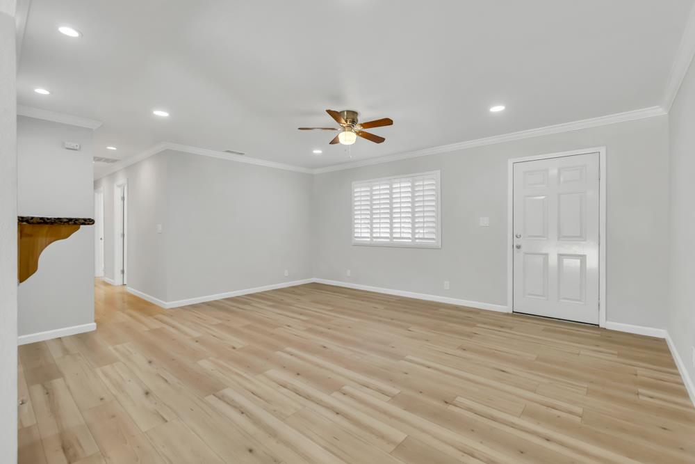 8843 Pershing Avenue Orangevale, CA 95662 - Photo 4 of 29 a view of an empty room with a window and wooden floor