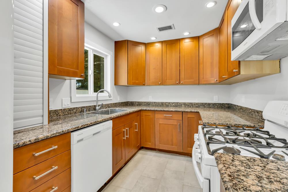 8843 Pershing Avenue Orangevale, CA 95662 - Photo 5 of 29 a kitchen with granite countertop cabinets and a sink
