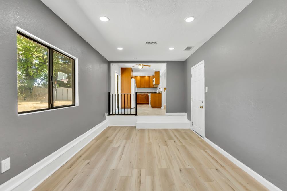 8843 Pershing Avenue Orangevale, CA 95662 - Photo 10 of 29 a view of a room with wooden floor and windows