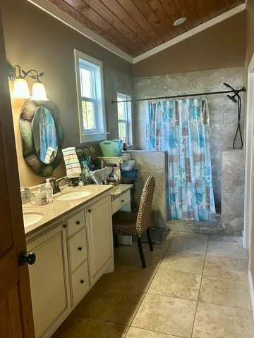 a bathroom with a sink mirror and a vanity