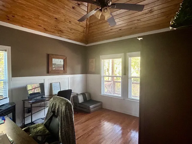a bedroom with furniture and a window