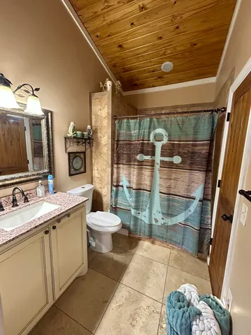 a bathroom with a sink and toilet