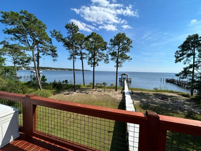 a view of a street with large trees