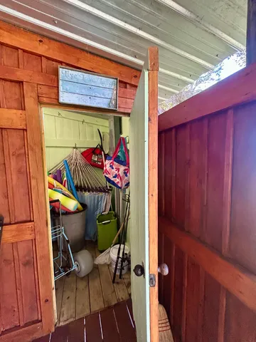 a view of a dining room with furniture and a window