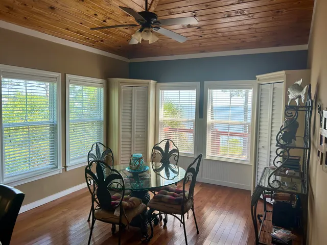 a view of a dining room with furniture window and outside view