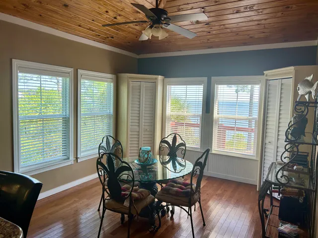 a view of a dining room with furniture window and outside view