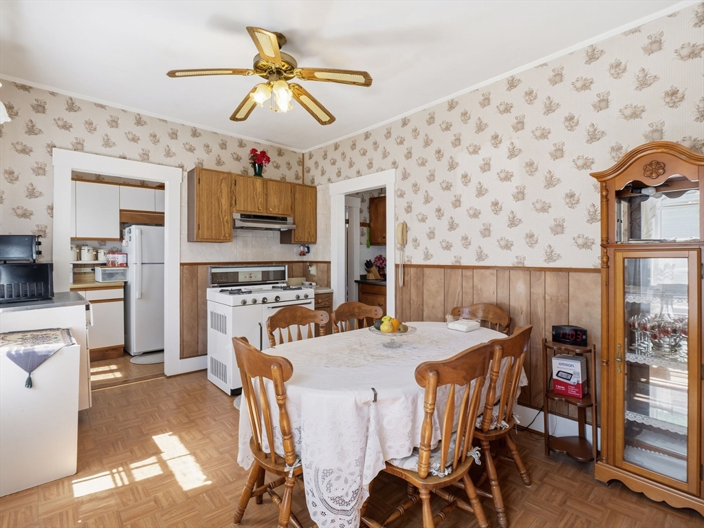 223 Stackpole Street Lowell, MA 01852 - Photo 29 of 42 a view of a dining room with furniture and a chandelier