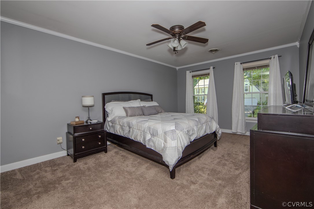 2306 Shadow Ridge Court Midlothian, VA 23112 - Photo 14 of 27 a bedroom with a bed and a chandelier