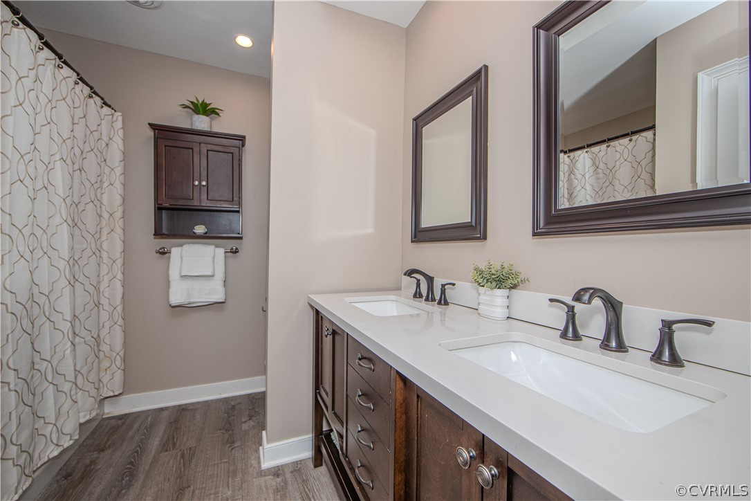 2306 Shadow Ridge Court Midlothian, VA 23112 - Photo 15 of 27 a bathroom with a sink and a mirror