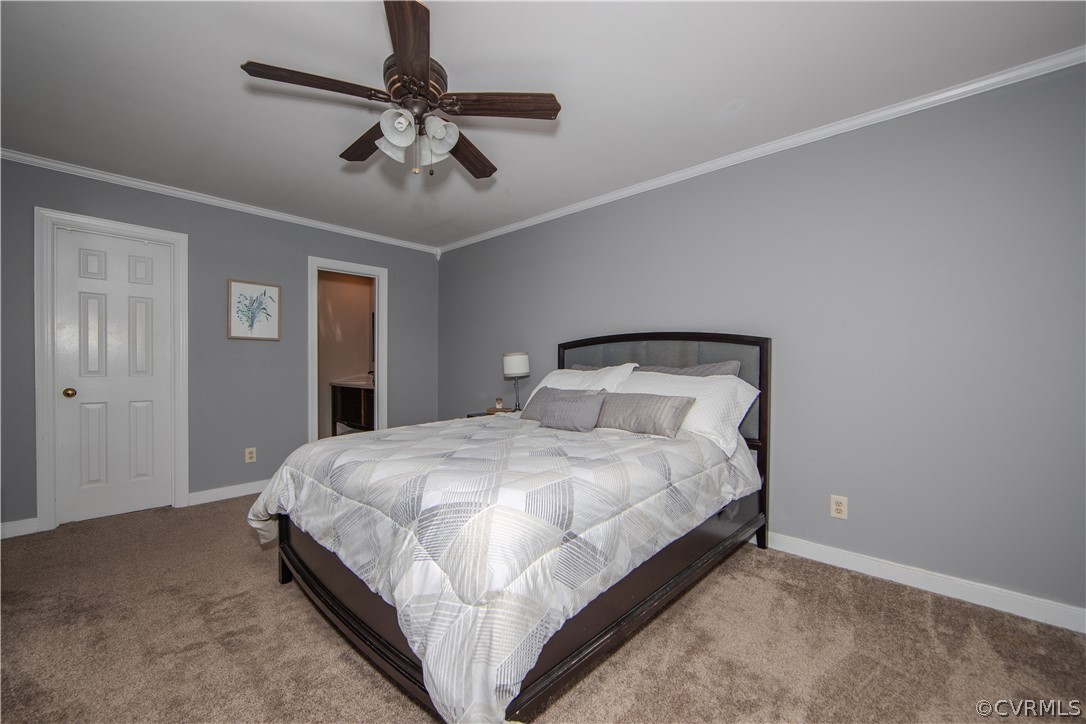 2306 Shadow Ridge Court Midlothian, VA 23112 - Photo 16 of 27 a bedroom with a bed and ceiling fan