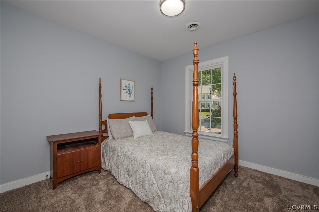 2306 Shadow Ridge Court Midlothian, VA 23112 - Photo 17 of 27 a bed room with a bed and a window