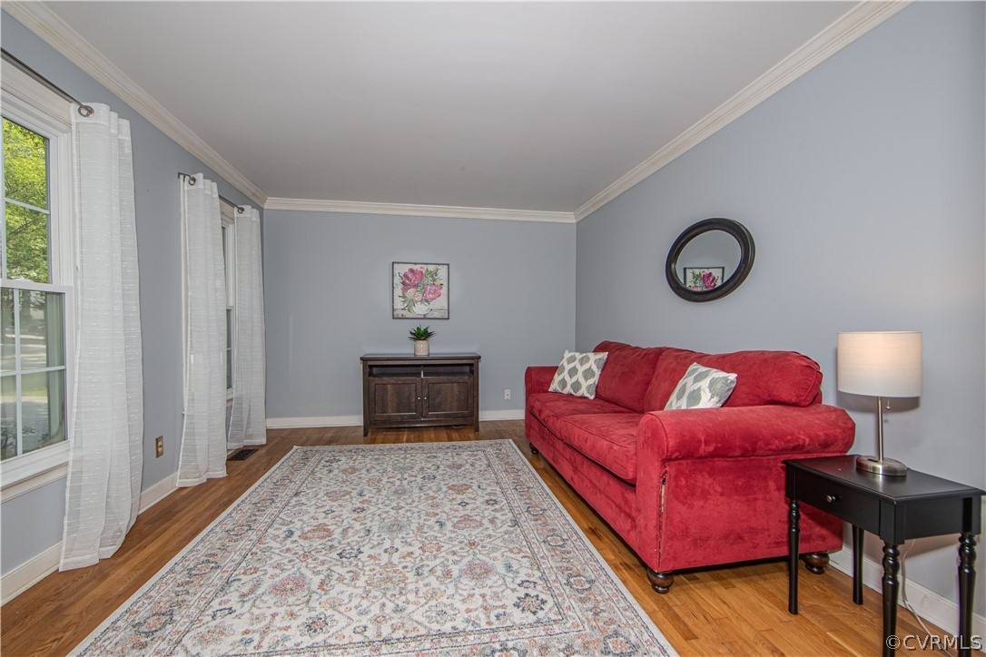 2306 Shadow Ridge Court Midlothian, VA 23112 - Photo 2 of 27 a bedroom with a bed and a table in it